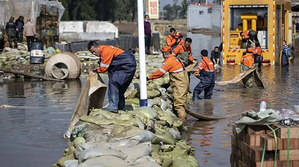 Dozen killed, nearly 2mn affected in heavy flood in China