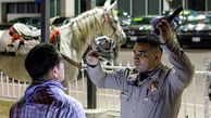 اسب سواری جنجالی مرد مست در خیابان+عکس