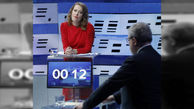 رقیب خانم پوتین هنگام مناظره انتخاباتی ژست عجیبی گرفت+عکس