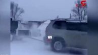  بکسل زنجیروار یک کامیون در جاده یخ زده + فیلم