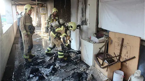 مهار شعله های آتش در برج 14 طبقه در تهران + عکس 