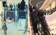 Terrified toddler's fingers trapped in escalator as dozens of shoppers rush to help her