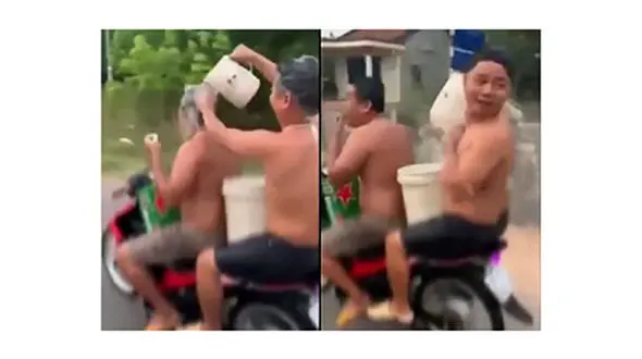 حمام کردن حین موتورسواری در خیابان!