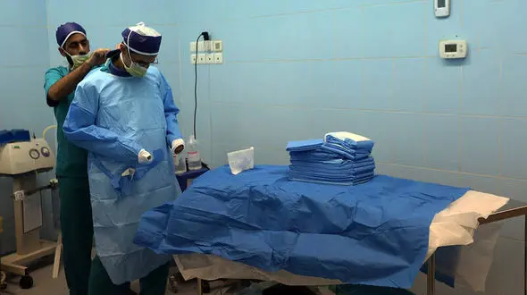 عمل جراحی ستون فقرات کشتی‌گیر تیم ملی + عکس