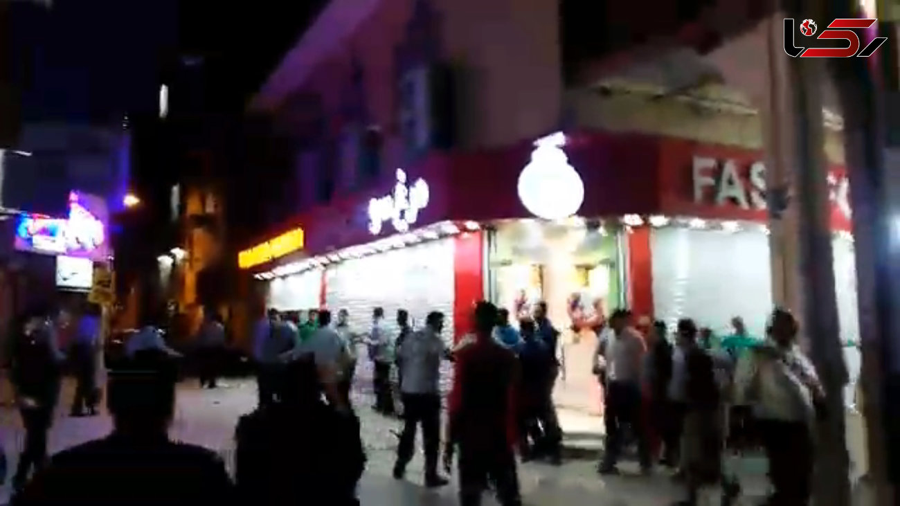 درگیری دست فروش های بازار ته لنجی ها با ماموران+فیلم و عکس