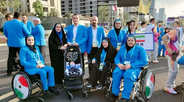 ساره جوانمردی با کودکش در بازی های پاراآسیایی هانگژو/ حمل کالسکه قبل از پرچمداری کاروان + عکس و فیلم