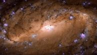 تصویر یک کهکشان مارپیچی متتشر شد + عکس