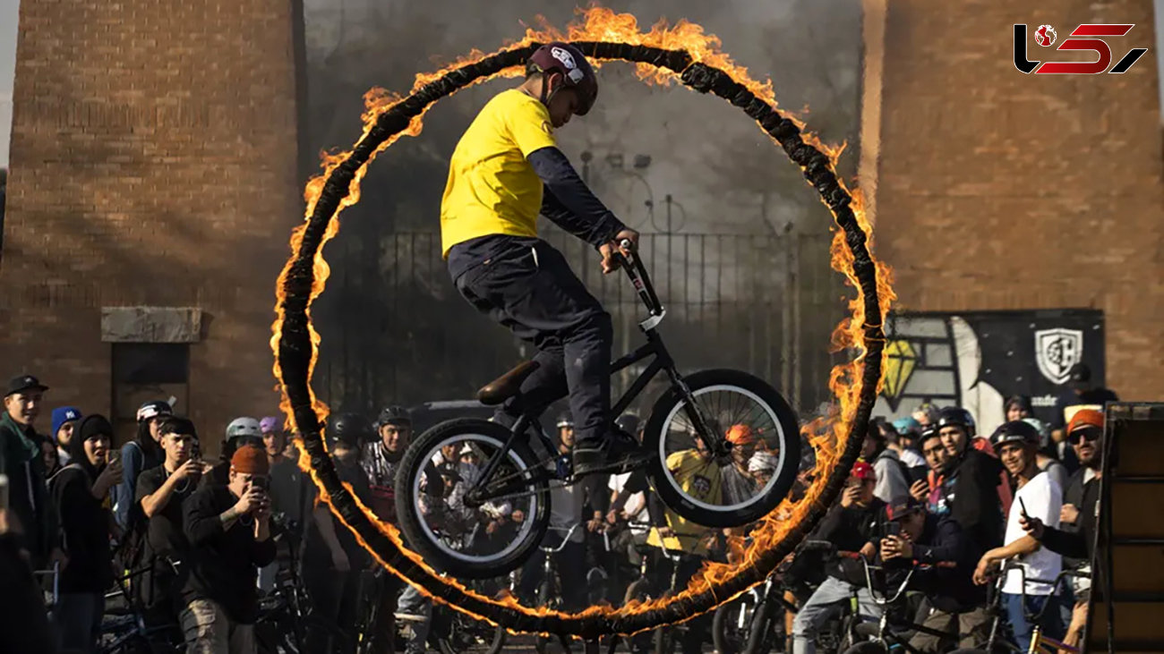 این دوچرخه سوار از دل آتش گذشت + عکس