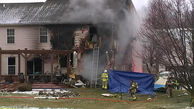 Small plane crashes into Michigan home, killing three
