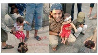 لحظه بازی کردن نوزاد با سربریده سرباز سوری + عکس (16+)