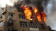 نجات 12 ساکن یک ساختمان از میان آتش