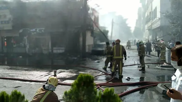 آتش سوزی 2 مغازه در خیابان بنی هاشم تهران + عکس ها