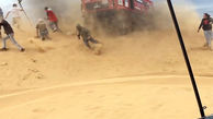 صحنه عجیب زیر گرفتن عکاس در رالی صحرا + فیلم و عکس