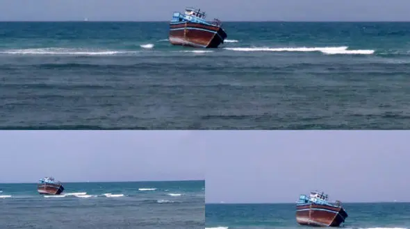 عکس از لنج باری که در سنگ های مرجانی عسلویه به گل نشست