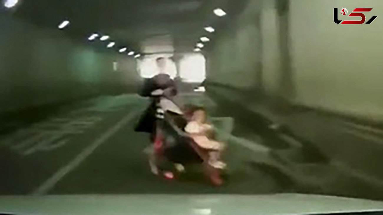 اقدام خطرناک یک زن در تونل / او به بچه اش هم رحم نداشت ! + فیلم / چین