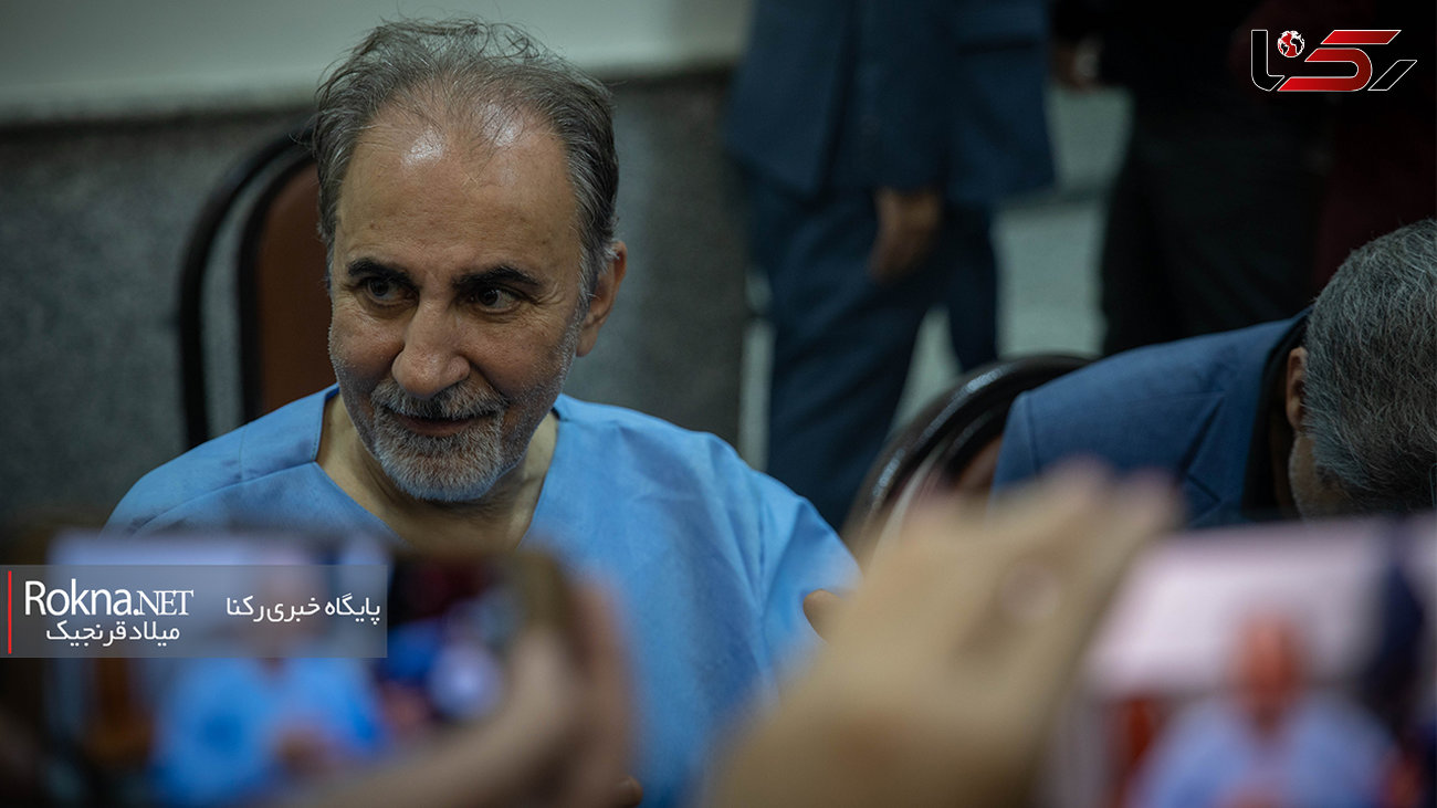 عکس های دیده نشده از گفتگوی خبرنگاران به نجفی در لباس زندان