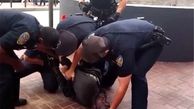 تظاهرات در آمریکا علیه تیراندازی پلیس به نوجوان سیاه‌پوست/۴ نفر دستگیر شدند+تصاویر
