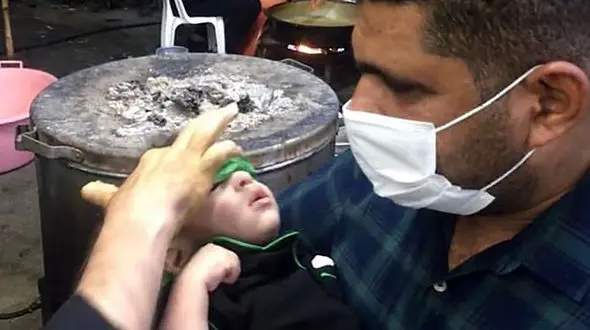 شفا یافتن کودک نابینا در حرم امام حسین(ع) + عکس 