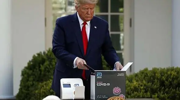 ترامپ از دستگاه ضدعفونی ماسک رونمایی کرد + عکس