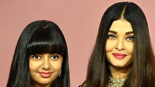 جشن تولد ساده و خودمونی دختر آیشواریا، چهره محبوب هند/تزئین زیبای کیک شکلاتی با فندق و خلال بادوم