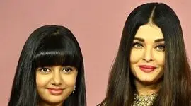 جشن تولد ساده و خودمونی دختر آیشواریا، چهره محبوب هند/تزئین زیبای کیک شکلاتی با فندق و خلال بادوم