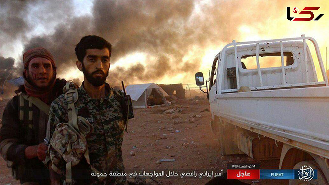 عکسی که داعش در آن ادعا می کند یک رزمنده ایرانی را اسیر کرده است 