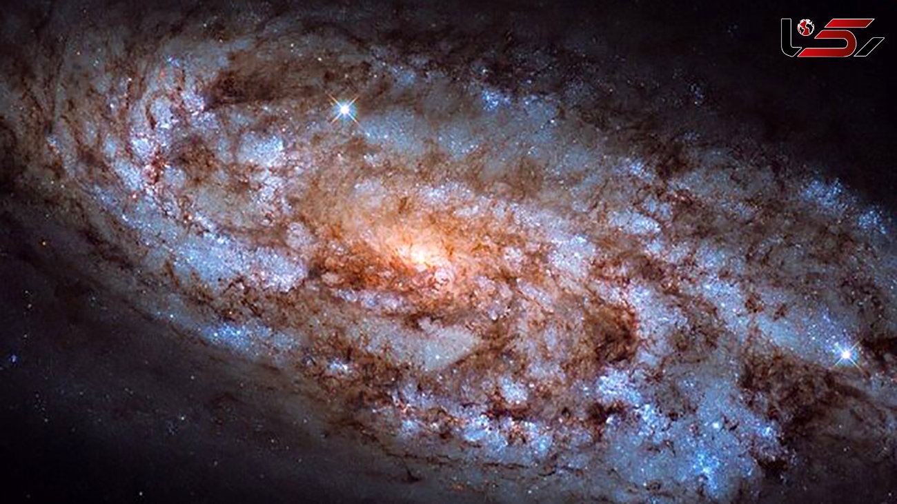 کهکشان مارپیچی ستاره فشان + عکس