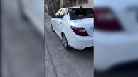 ببینید / پاره کردن بدنه دنا پلاس توسط نیسان آبی در کنار خیابانی در تهران