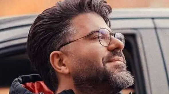 دانلود آهنگ بوی آتیشی توی سرما مثل نم نم بارونی از حامد همایون + متن کامل