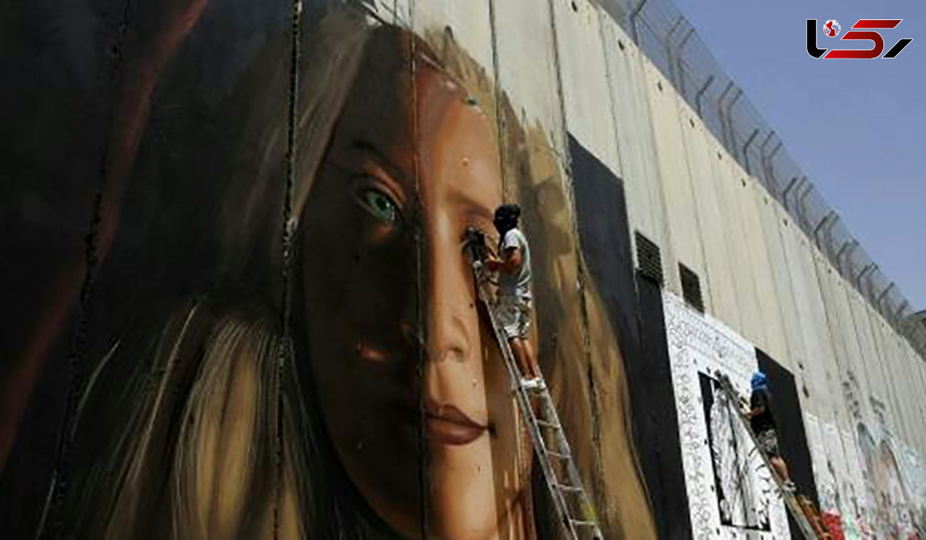 2 هنرمند ایتالیایی بخاطر نقاشی چهره یک دختر فلسطینی دستگیر شدند + عکس 