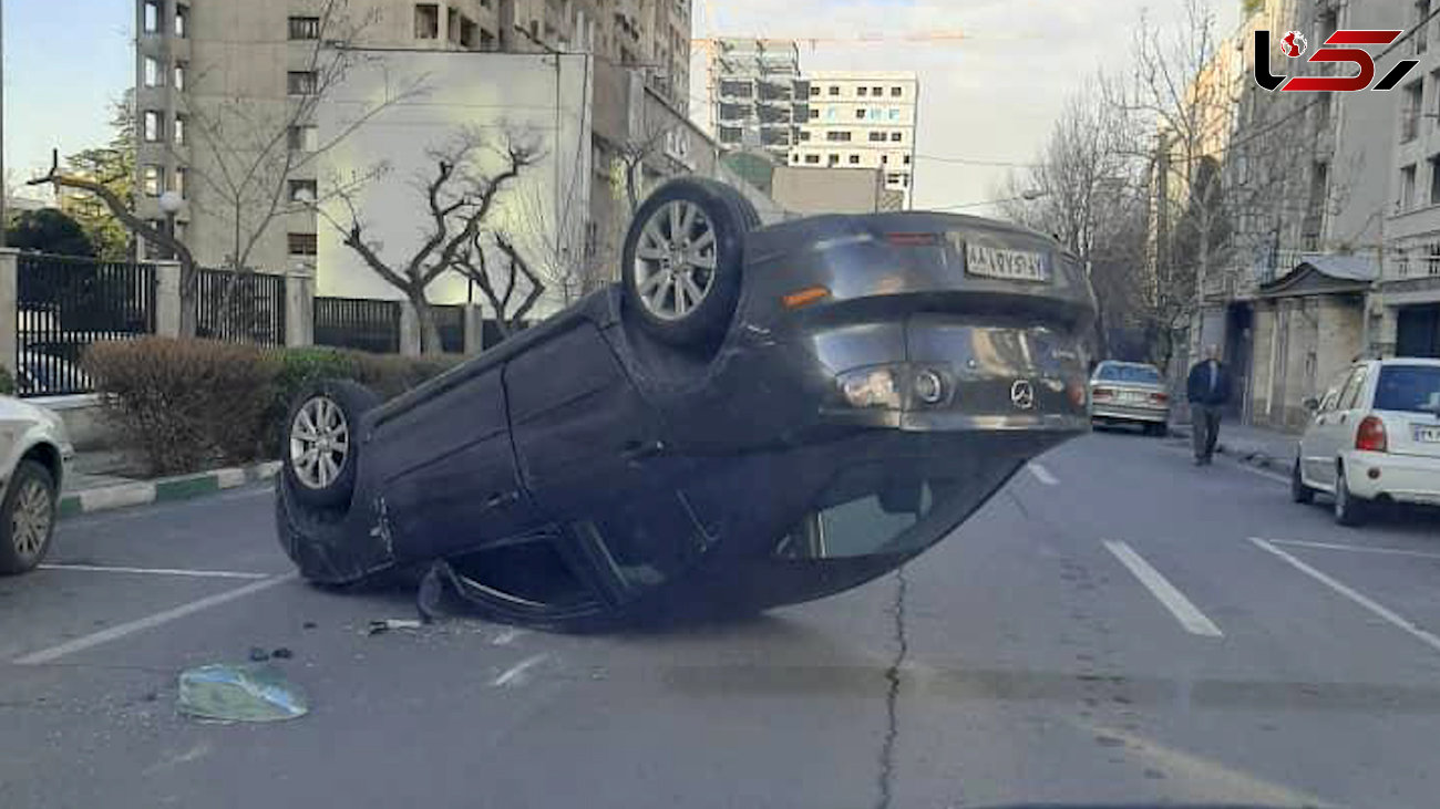عکس واژگون شدن خودرو مزدا 3 وسط خیابان ملاصدرا / صبح امروز رخ داد