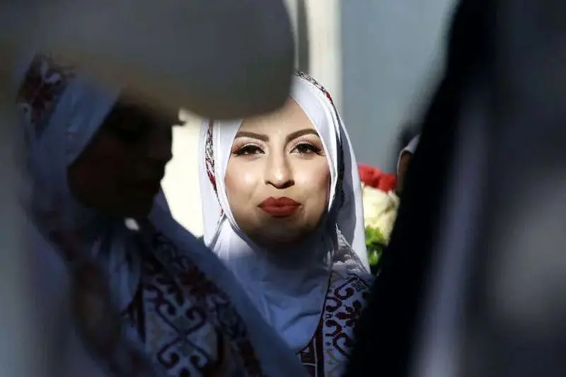 شهر خان‌یونس در جنوب نوار غزه روز سه‌شنبه شاهد برگزاری مراسم عروسی جمعی برای ۵۴ زوج