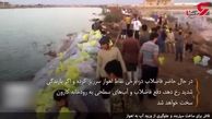 فیلم تلاش های بی وقفه مردم اهواز برای ساخت سیل‌بند 