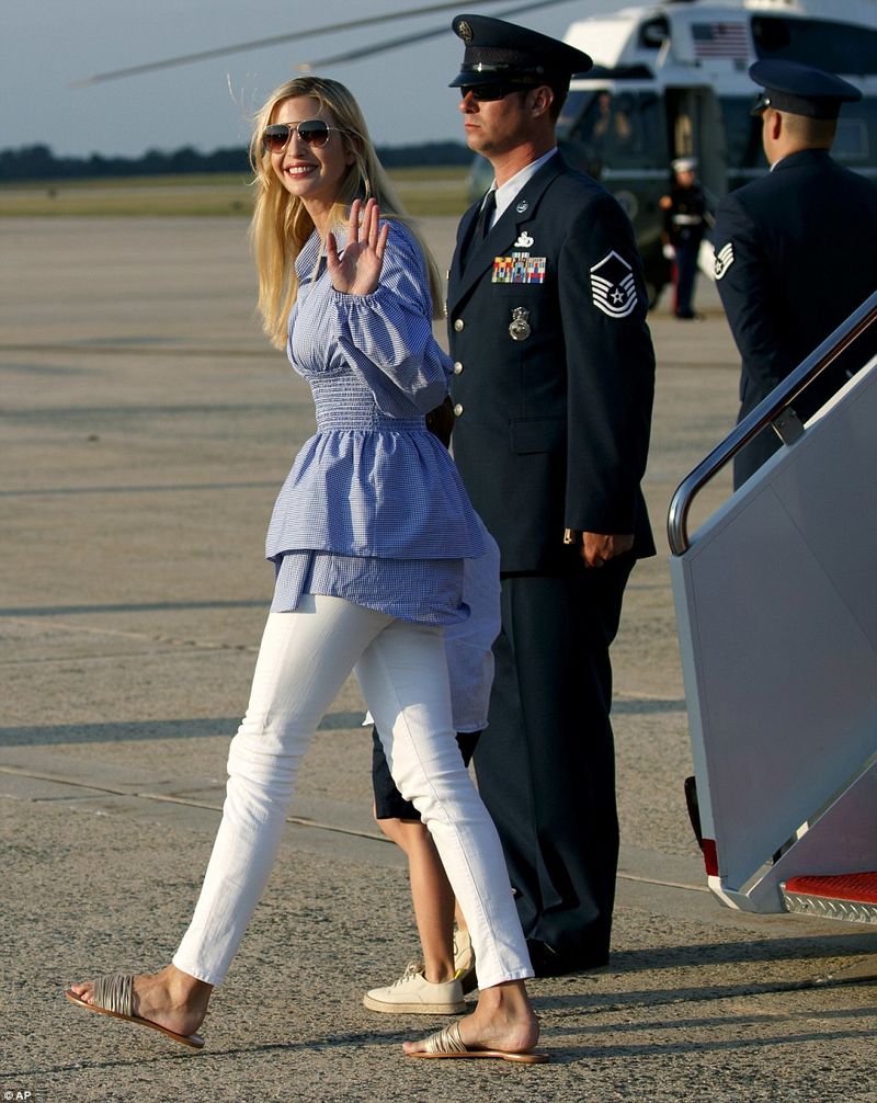 4EAE9D4700000578-6005795-Ivanka_waves_to_the_press_as_she_disembarks_Air_Force_One_and_pr-m-97_1532952607723