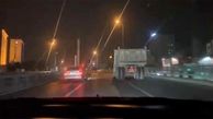 ببینید / حرکات جنون‌آمیز راننده BMW و راننده کامیون در تهران؛ بازی با جان مردم وسط خیابان!