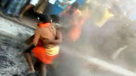 این مردان و زنان روی ذغال آتشین غلت می زنند + عکس