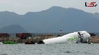 A collision between a cargo plane and a vehicle at Hong Kong International Airport has left two people dead.