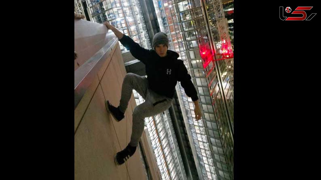 سرگرمی وحشتناک و نفس گیر پسر جوان در ارتفاع 213 متری یک برج 45 طبقه +عکس