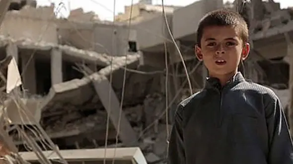 پسر 10 ساله داعشی، ترامپ را تهدید کرد + عکس