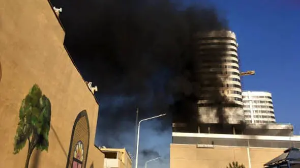 عکس های وحشتناک از آتش سوزی برج بلند مرتبه در مشهد +جزییات