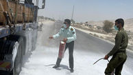 فداکاری پلیس عسلویه در حادثه آتش سوزی + عکس
