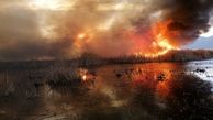 آتش به جان نیزار‌های حاشیه رودخانه زرینه رود افتاد