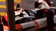 فیلم حمله مرد نقاب دار به خودور با چکش/ حمله به خودرو رباتی در وسط خیابان 