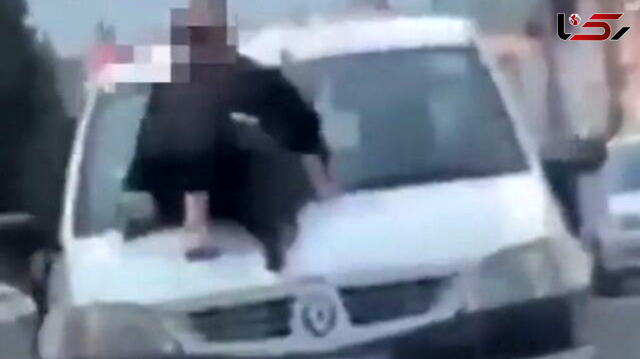 عکس حرکات نمایشی خطرناک یک زن روی ماشین ال 90 ! / در چالوس توقیف شد